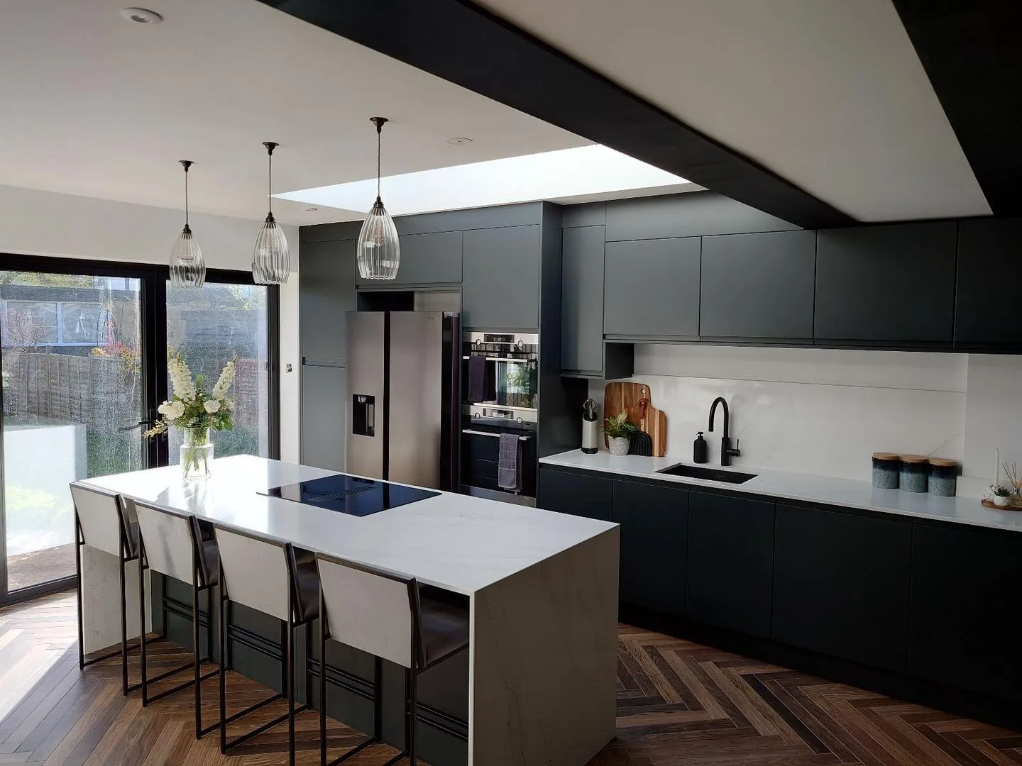 a kitchen with a center island and a breakfast bar