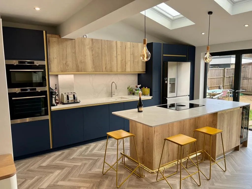 a kitchen with a center island with stools
